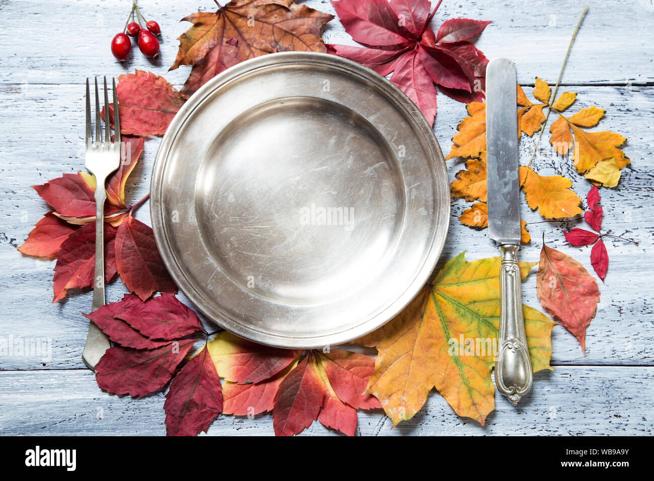 Fall table setting with the silver plate Stock Photo