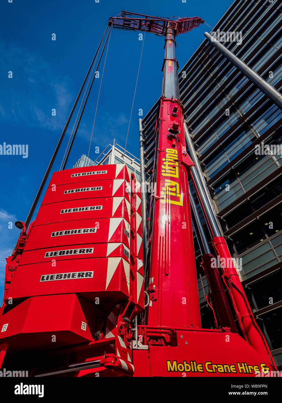Large Crane London - Mobile Crane from the City Lifting Company outside a Natwest Bank building in the City of London Financial District. Stock Photo