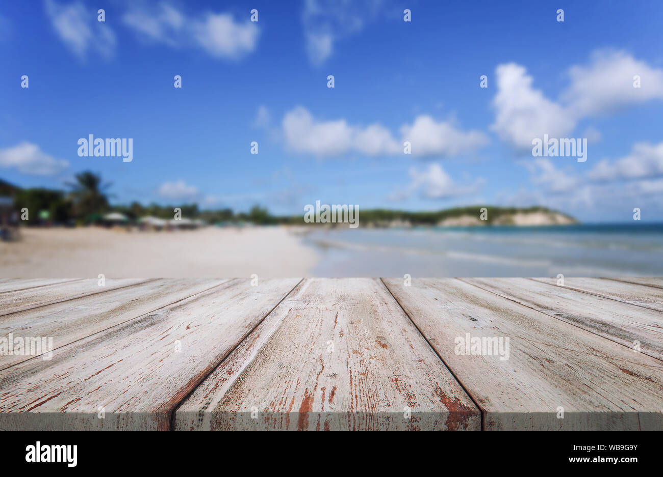 Abstract blur bokeh background with wooden desk Stock Photo - Alamy