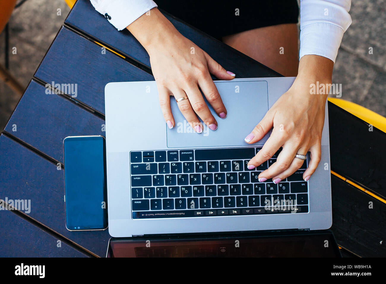 Close up shot of hands typing on laptop Stock Photo