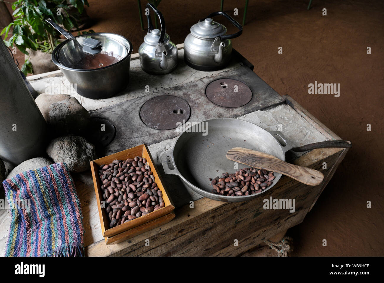 Roasting cacao seeds and making cocoa at a chocolate farm, Costa Rica Stock Photo
