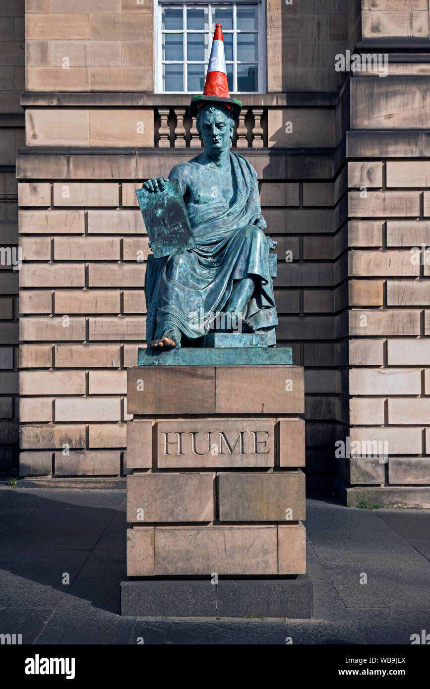 Statue of the philosopher and historian David Hume, complete with traffic cone, by sculptor Sandy Stoddart on Edinburgh's Royal Mile. Stock Photo