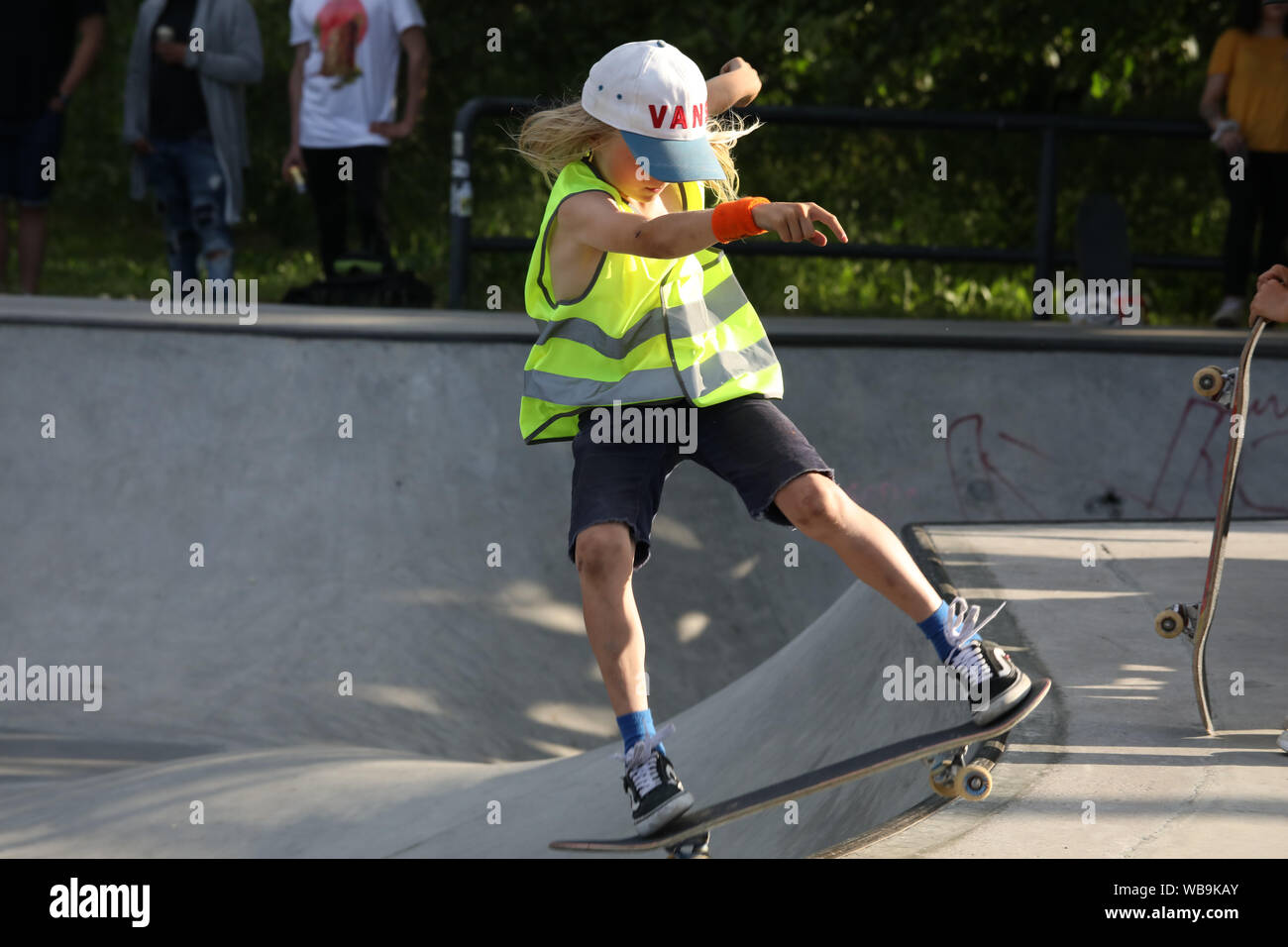 Young Skater With Long Hair On A Skateboard Stock Photo Alamy