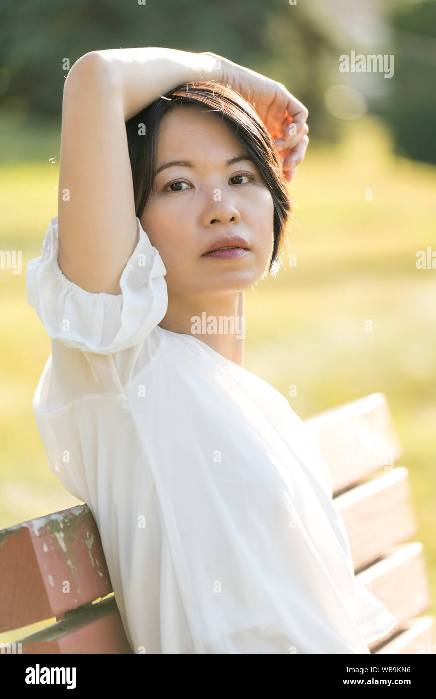 Portrait young woman outdoor back light Stock Photo