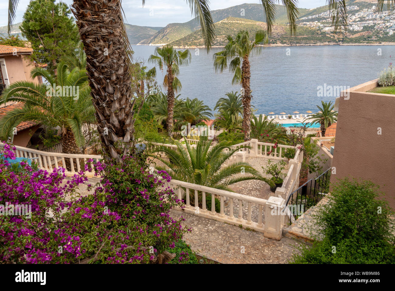 Turkish Villa Grounds and Sea with Mountains and Flowers Stock Photo