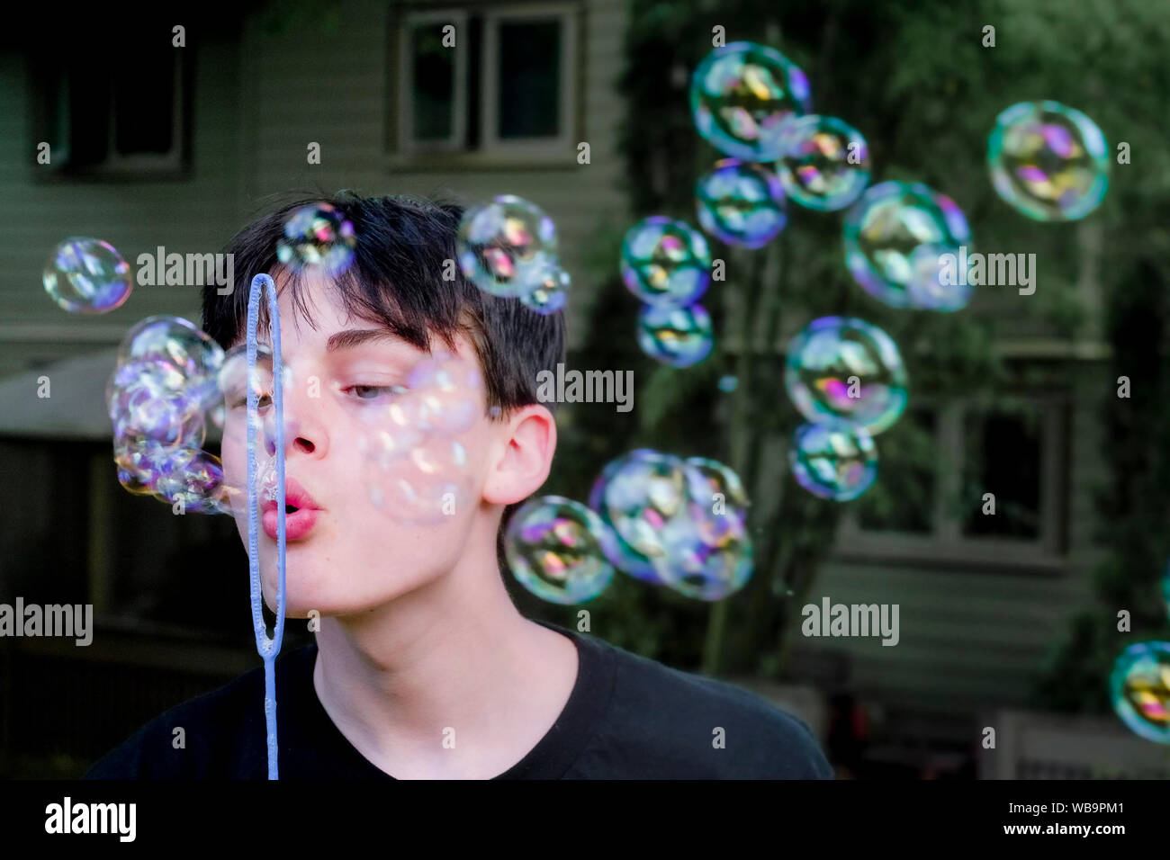 blowing soap bubbles