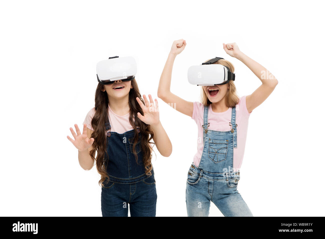 The future of VR is here. Little girls wearing virtual reality headsets