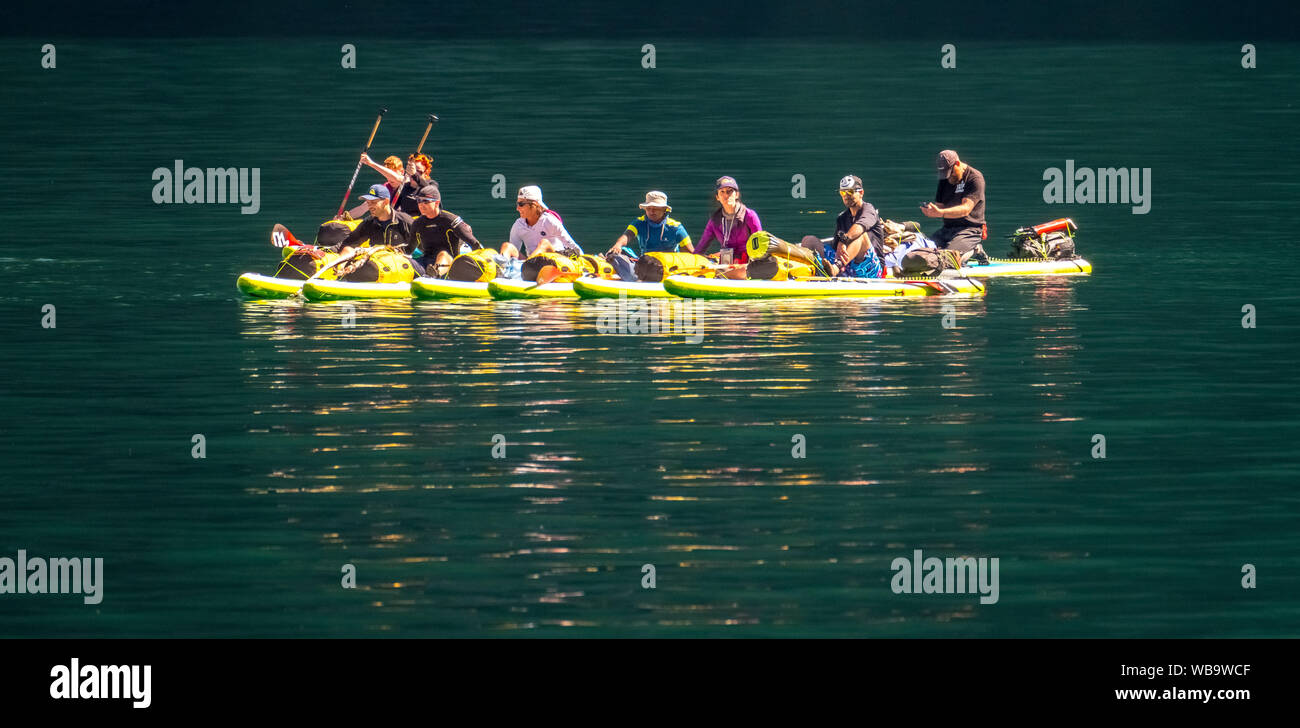 paddling tourists in yellow kayaks, fjord, Nærøyfjorden, Styvi, Sogn og Fjordane, Norway, Scandinavia, Europe, NOR, travel, tourism, destination, sigh Stock Photo