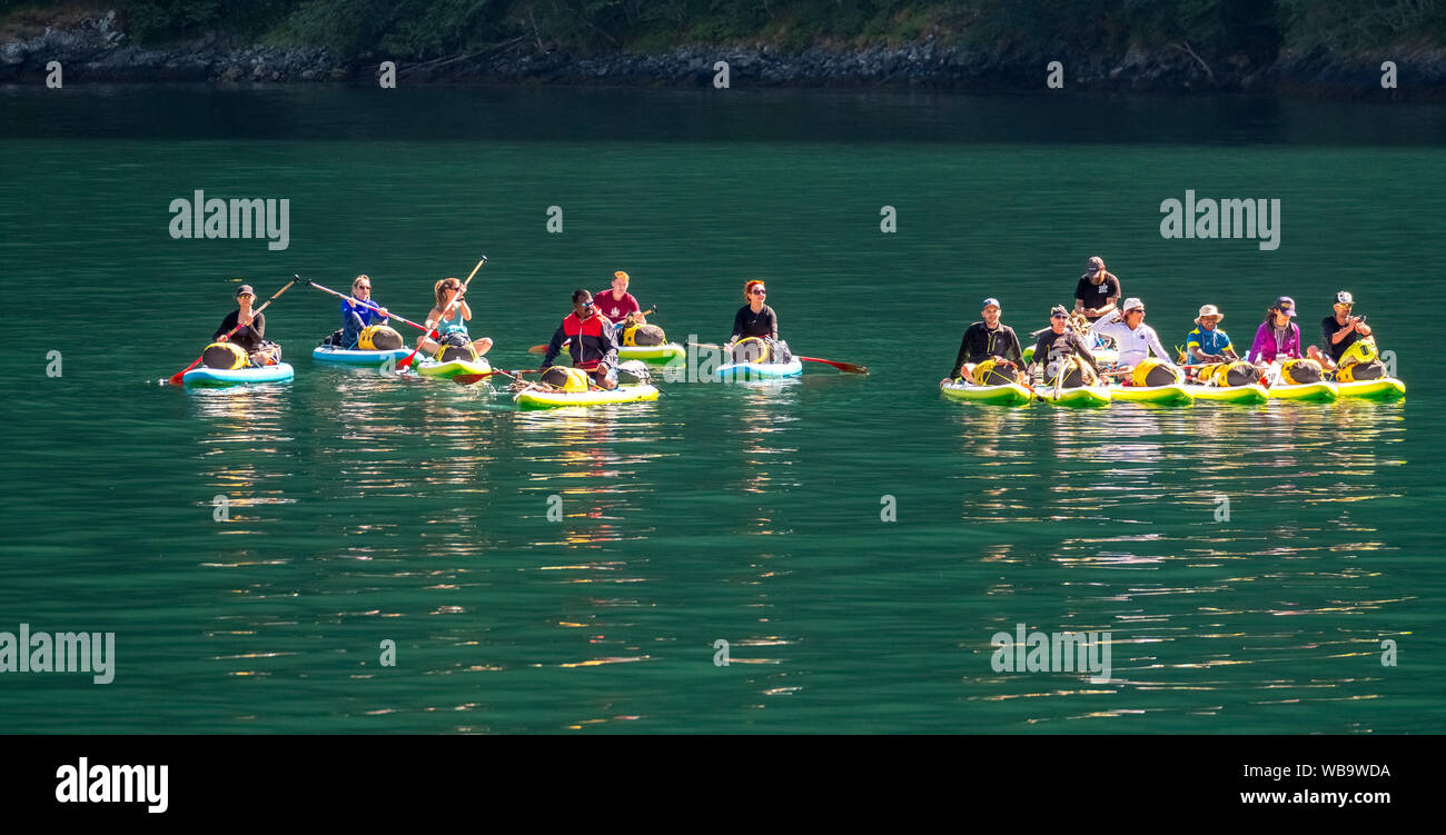 paddling tourists in yellow kayaks, fjord, Nærøyfjorden, Styvi, Sogn og Fjordane, Norway, Scandinavia, Europe, NOR, travel, tourism, destination, sigh Stock Photo