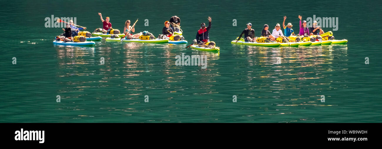 paddling tourists in yellow kayaks, fjord, Nærøyfjorden, Styvi, Sogn og Fjordane, Norway, Scandinavia, Europe, NOR, travel, tourism, destination, sigh Stock Photo