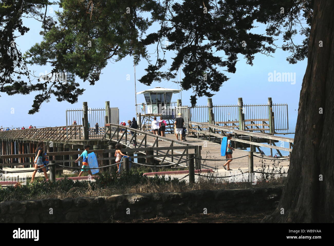 People walking on the historic pier at Seacliff State Park, Aptos, CA. Stock Photo