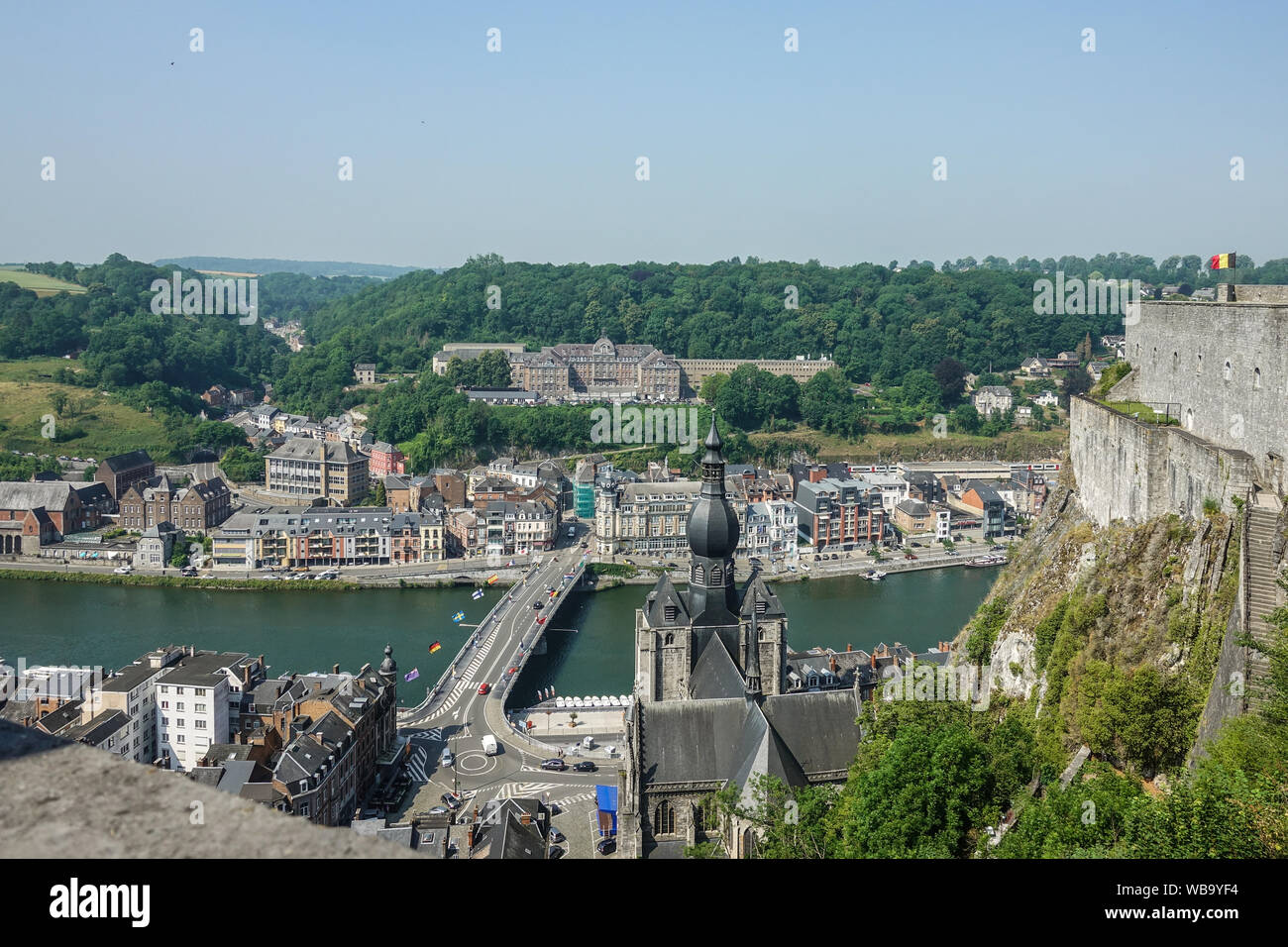 Dinant, Belgium - June 26, 2019: Seen from Citadelle. Large building on top is College Notre Dame de Bellevue, school system from primary to high scho Stock Photo