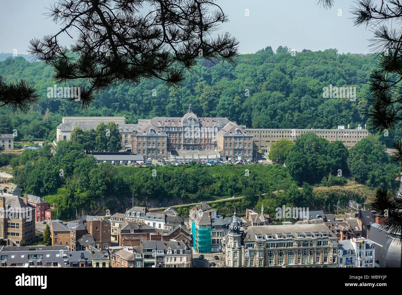 Dinant, Belgium - June 26, 2019: Seen from Citadelle. Large building is College Notre Dame de Bellevue, school system from primary to high school. For Stock Photo