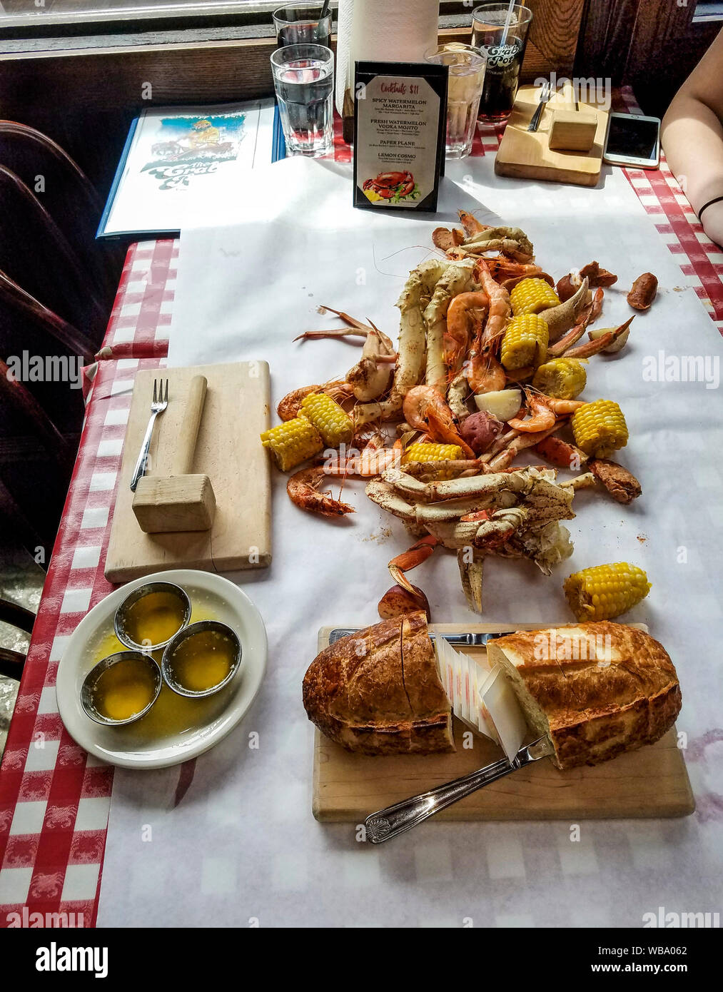The Royal Crab Feast at Seattle's Crab Pot restaurant. It includes four kinds of crab, shrimp, sausage and more. Stock Photo