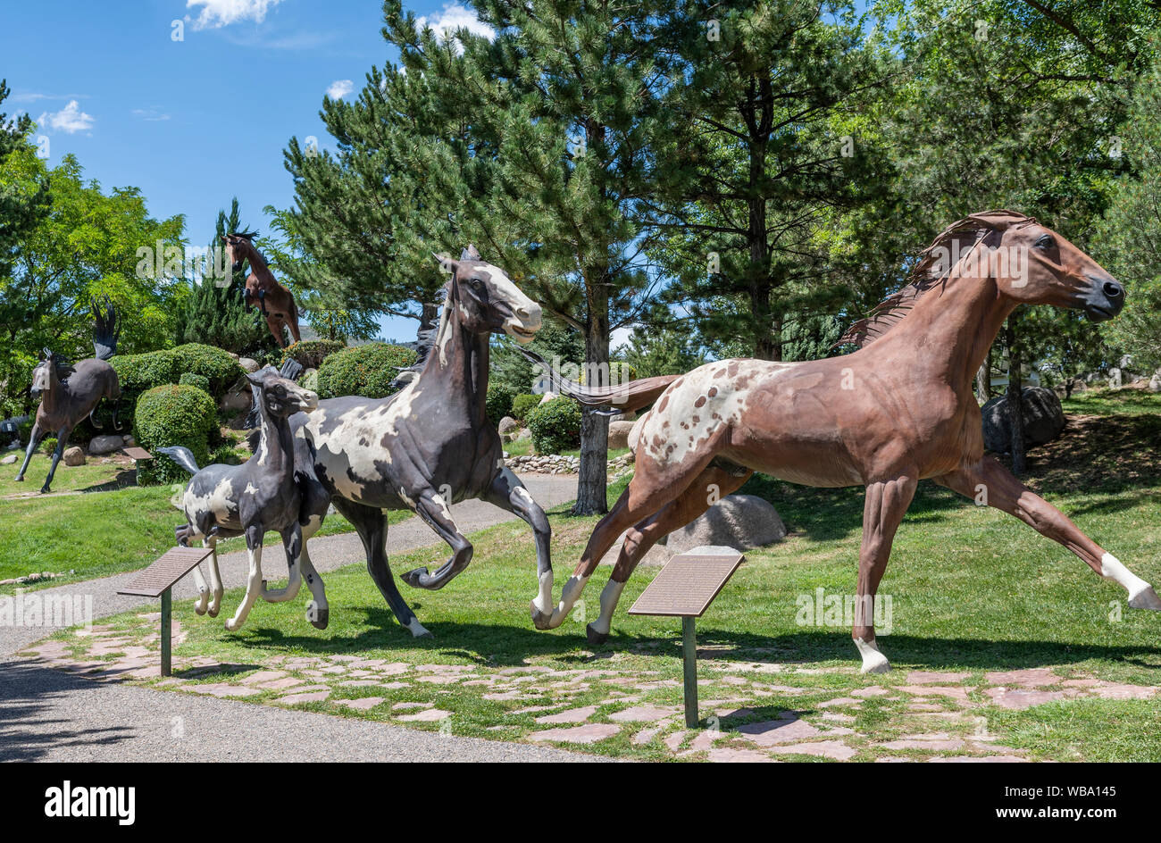 Ruidoso Downs, New Mexico, Free Spirits at Noisy Water bronze sculpture by Dave McGary representing seven horse breeds, including Appaloosa and Paint. Stock Photo