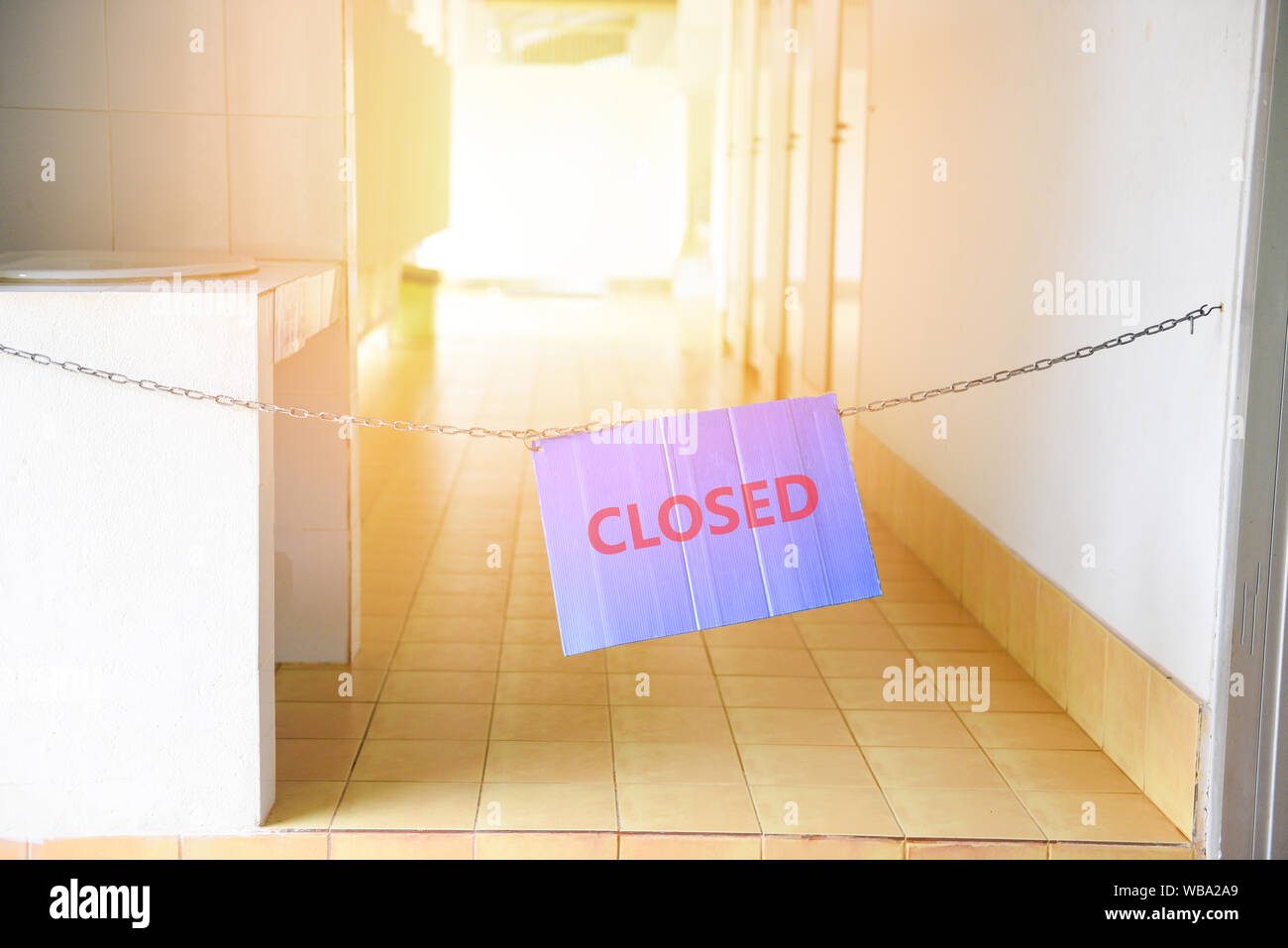 sign closed hang on walkway in the Public toilet for cleaning or No ...