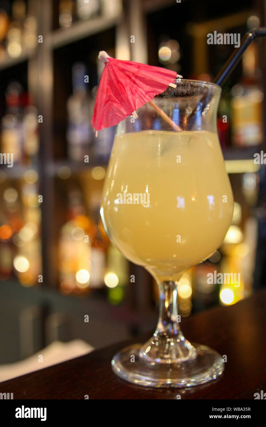 A refreshing alcoholic pineapple cocktail served at a bar Stock Photo