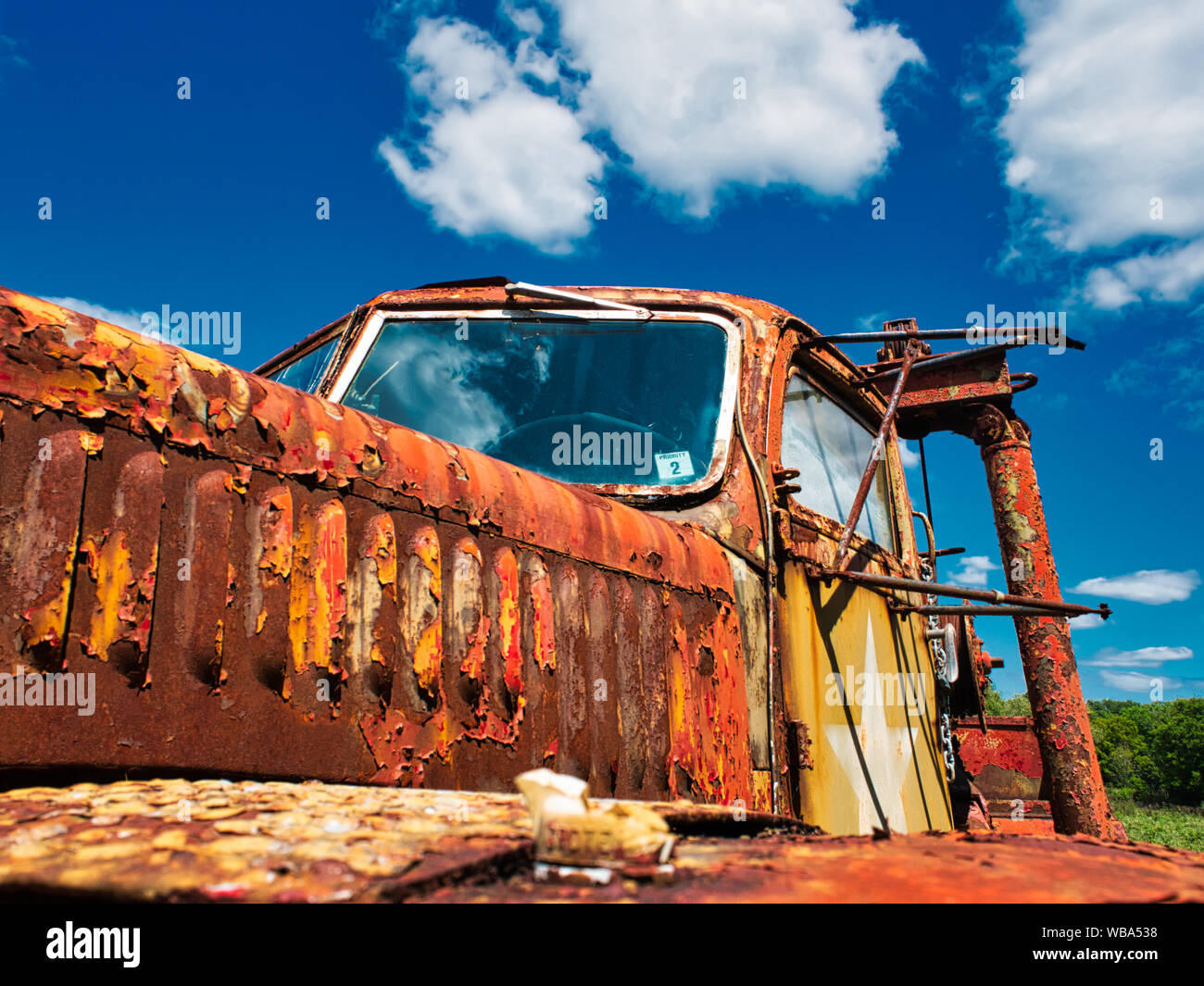 Rusty old military truck with sky in back ground Stock Photo