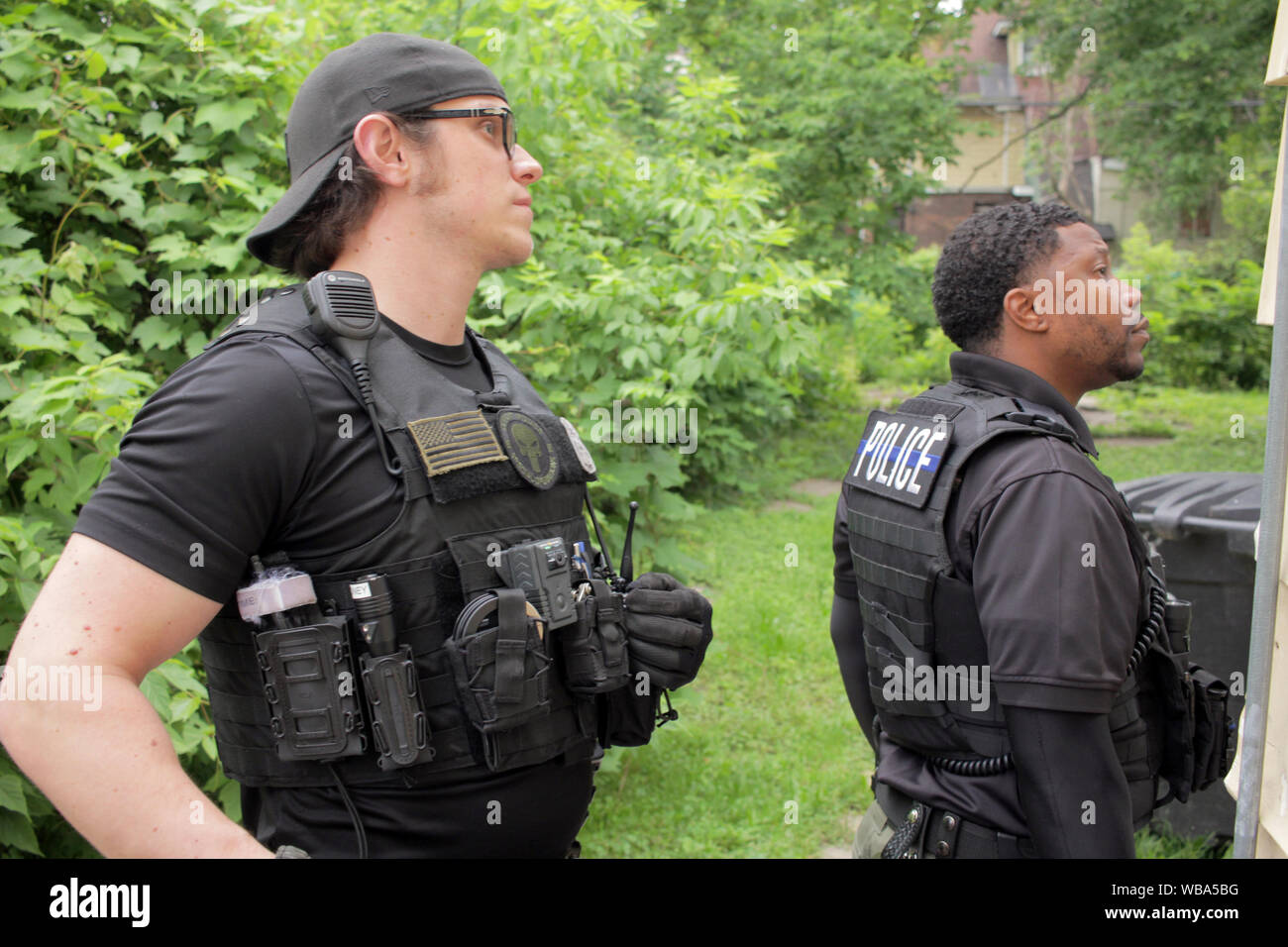 Detroit Special Ops police officers search for a wanted suspect