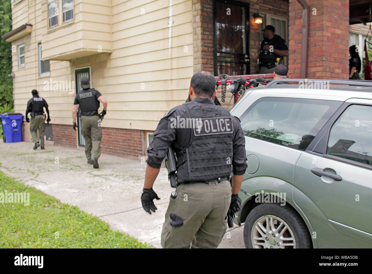 Detroit Special Ops police officers search for a wanted suspect