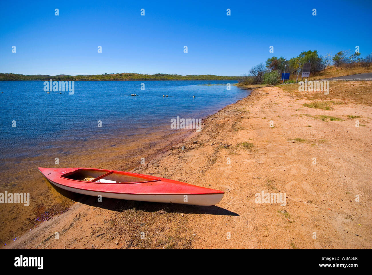 Canoe beside a reservoir. Croydon, Gulf Savannah, Queensland, Australia