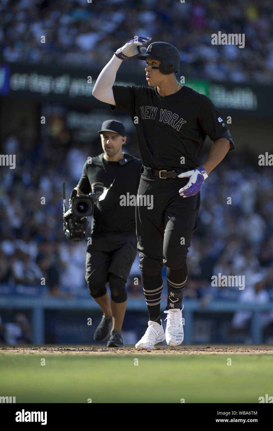 Los Angeles, CALIFORNIA, USA. 25th Aug, 2019. Aaron Judge #99 of the New  York Yankees crosses the plate after hitting a solo home run in the third  inning of the game against