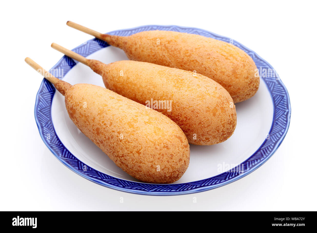 Corn dogs on a plate. This food is called American dog all over Japan. Stock Photo