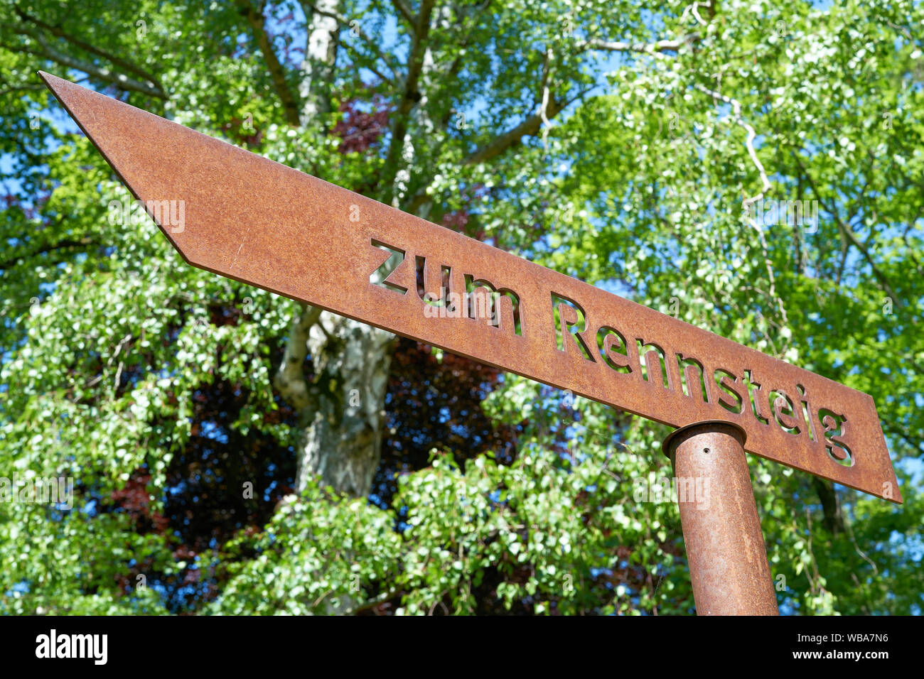 Signpost to the hiking trail 'Rennsteig' in Thuringia in Germany. The popular hiking trail is about 169 kilometers long. Stock Photo