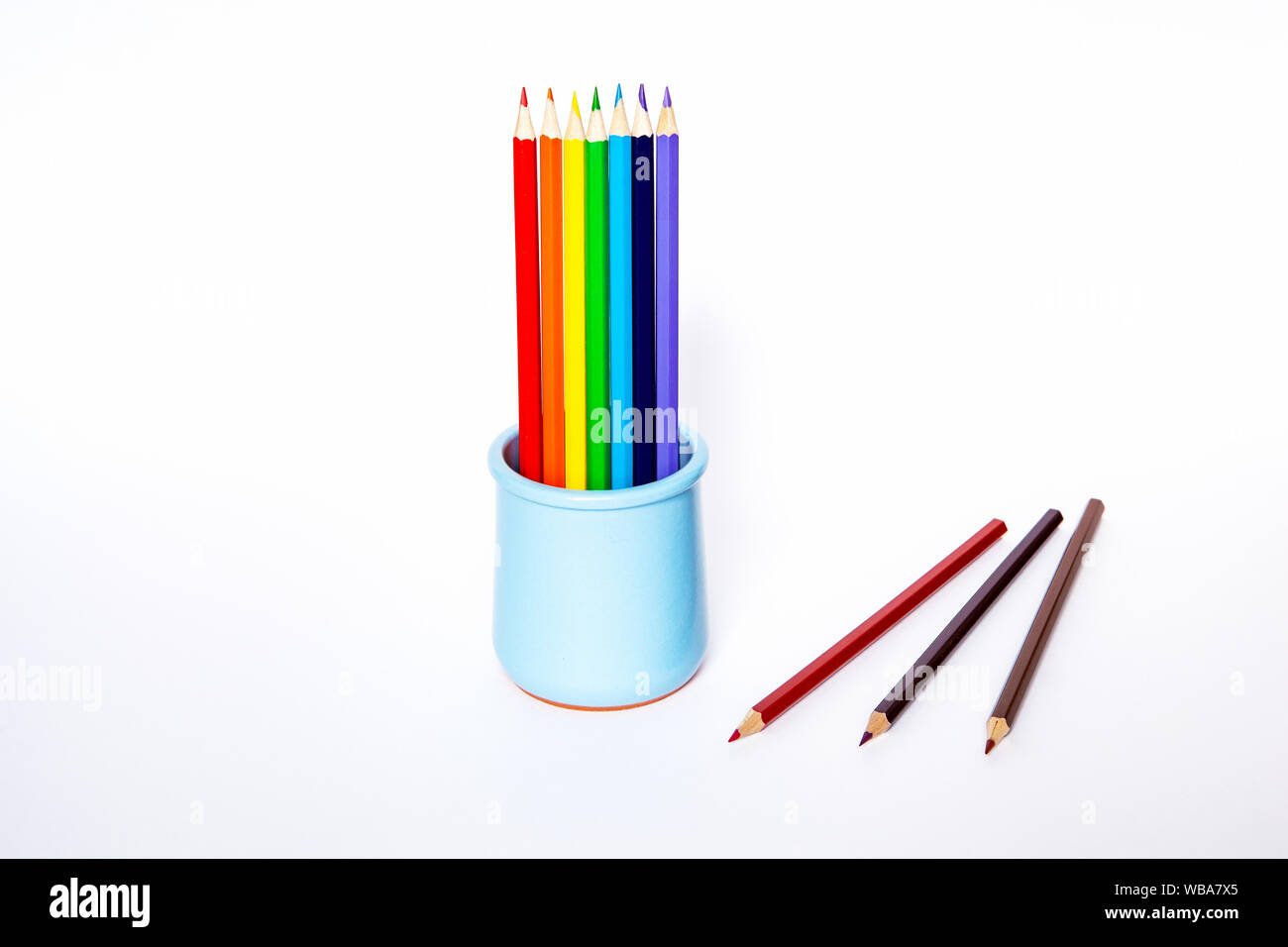Image with blue vase with pencils on white background for web background design. School equipment set. Stock Photo