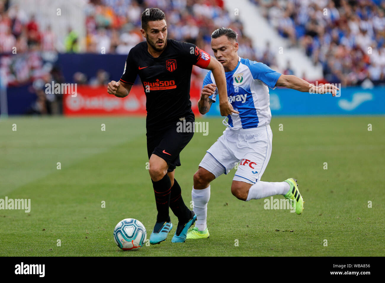 Madrid, Spain. 25th Aug, 2019. CD Leganes's Roque Mesa and Atletico de Madrid's Jorge Resurreccion Koke are seen in action during the La Liga football match between CD Leganes and Atletico de Madrid at Butarque Stadium in Madrid.(Final score; CD Leganes 0:1 Atletico de Madrid) Credit: SOPA Images Limited/Alamy Live News Stock Photo