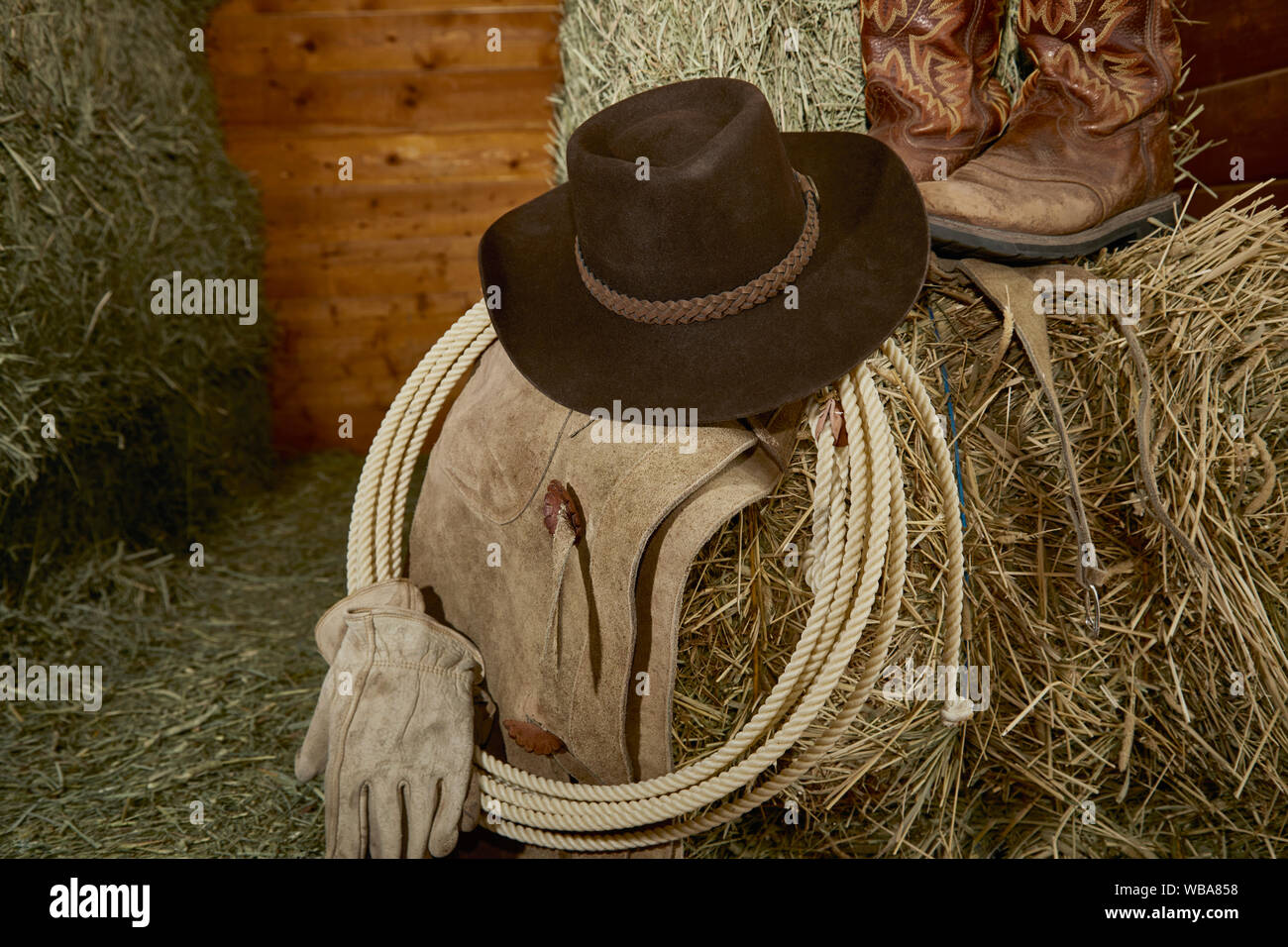 Western Cowboy hat with cowboy boots, leather gloves, leather chaps and