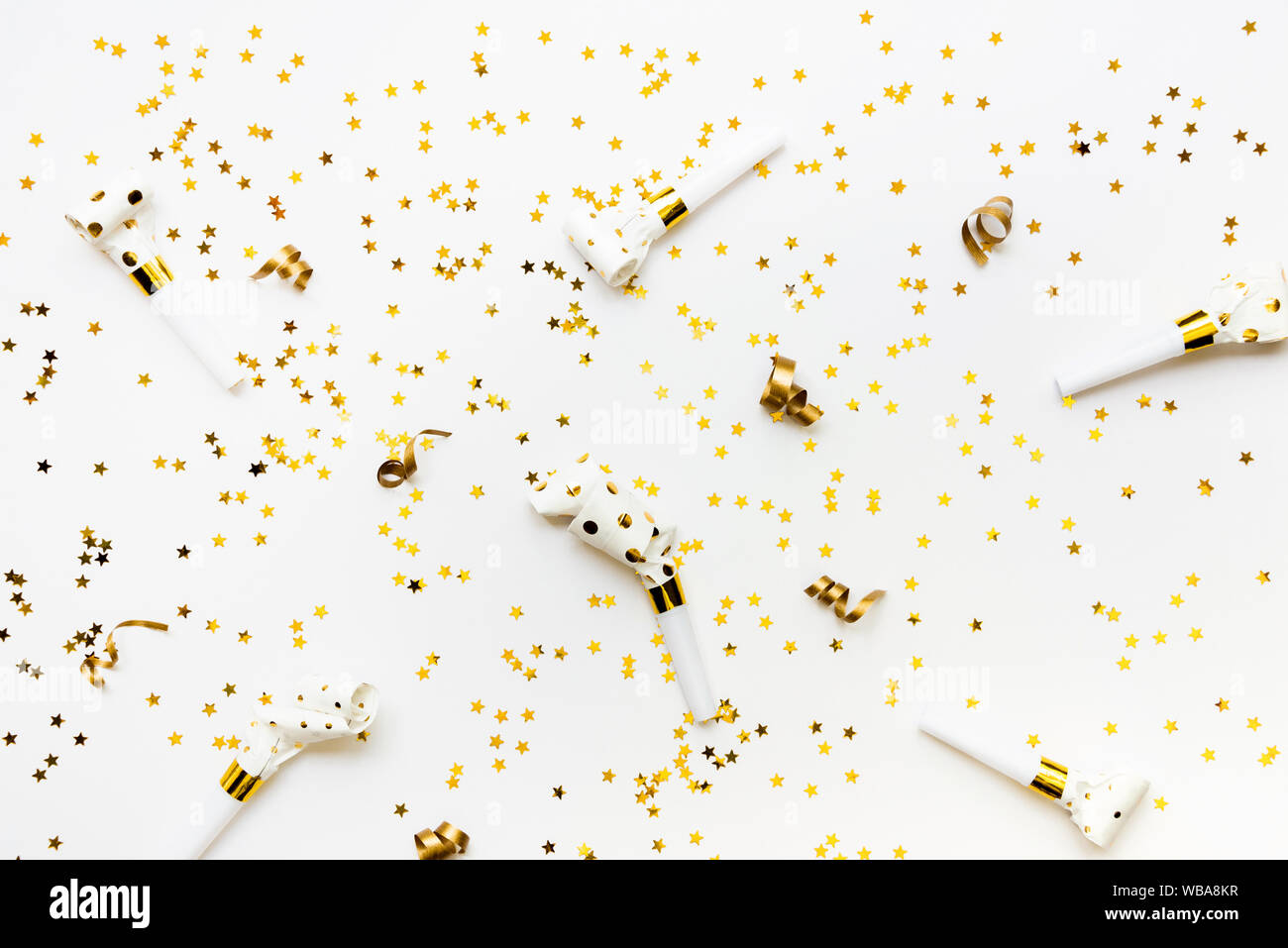 Celebration background - party accessories in golden colors. Stock Photo