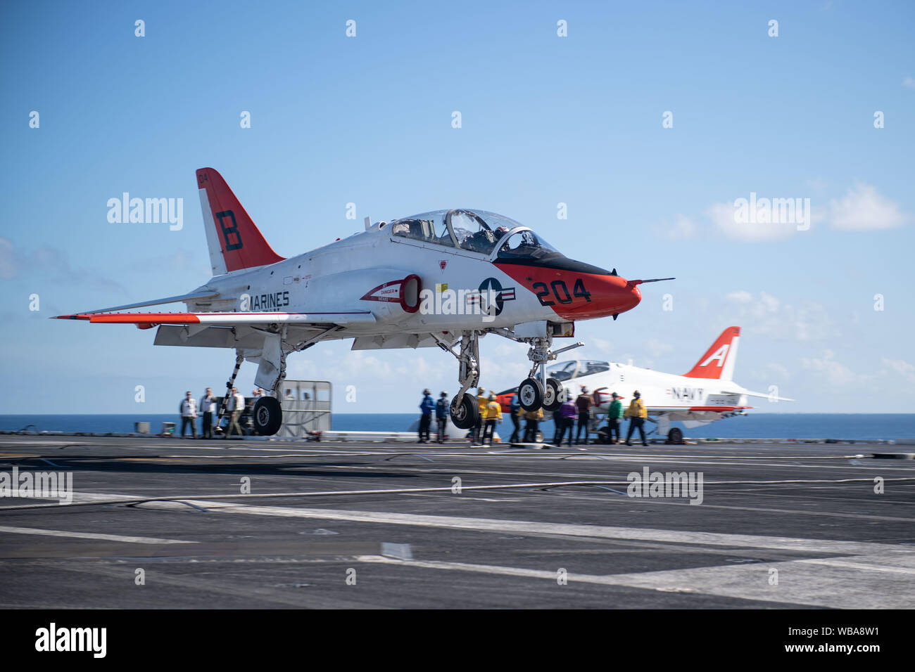 A T-45C Goshawk training aircraft, assigned to Training Air Wing (TW) 2, prepares to land on the flight deck of the aircraft carrier USS John C. Stennis (CVN 74) in the Atlantic Ocean, Aug. 23, 2019. The John C. Stennis is underway conducting carrier qualifications in support of Chief of Naval Air Training Command. (U.S. Navy photo by Mass Communication Specialist 3rd Class Skyler Okerman) Stock Photo