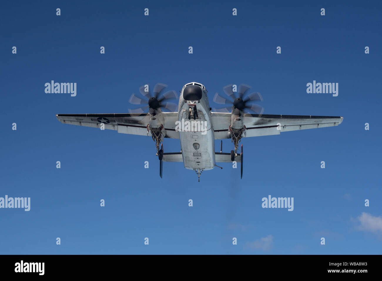 A C-2A Greyhound, assigned to Fleet Logistics Combat Support Squadron (VRC) 40, approaches the aircraft carrier USS John C. Stennis (CVN 74) in the Atlantic Ocean, Aug. 22, 2019. The John C. Stennis is underway conducting routine operations in support of Commander, Naval Air Force Atlantic. (U.S. Navy photo by Mass Communication Specialist Seaman Jarrod A. Schad) Stock Photo