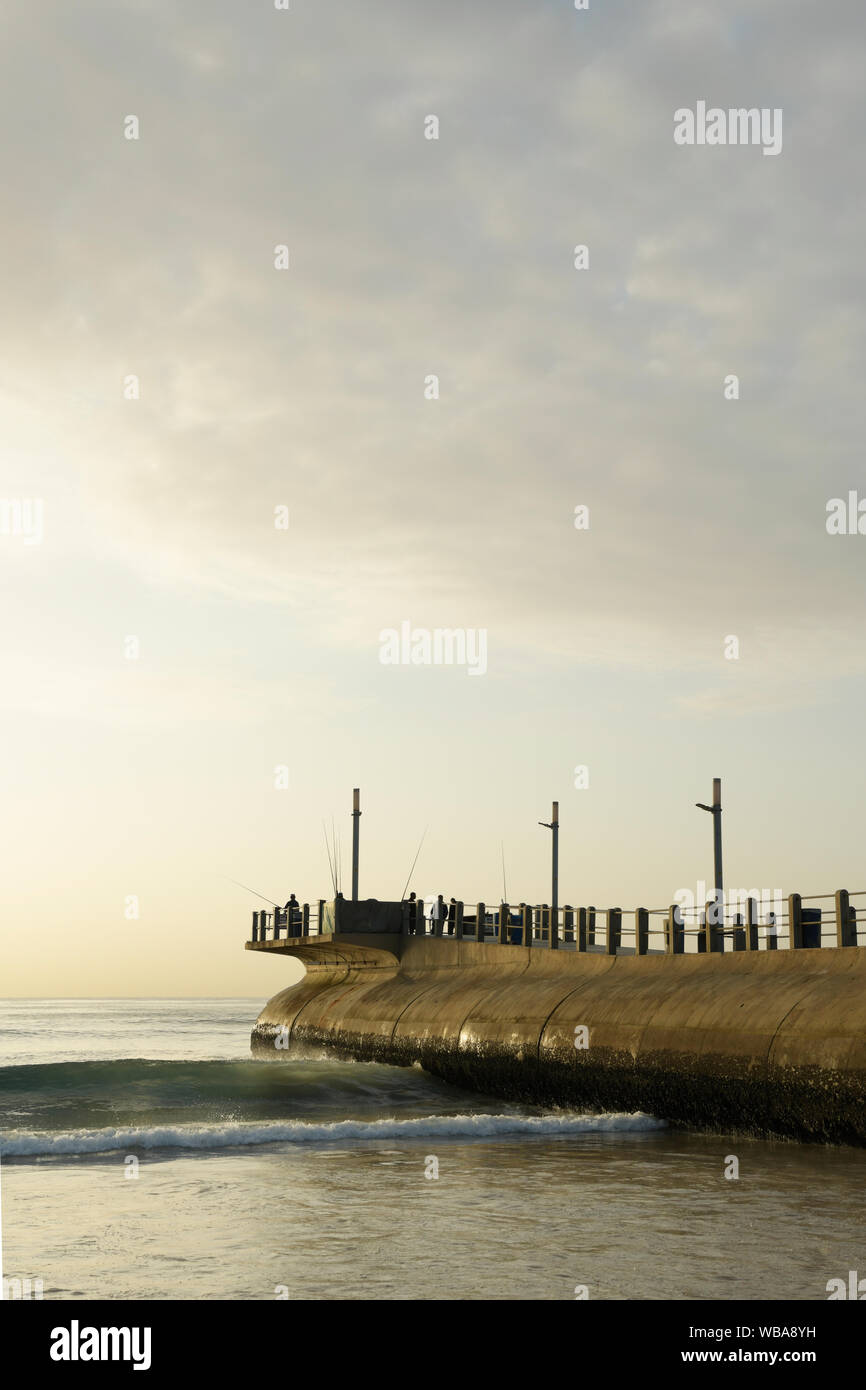 Durban, KwaZulu-Natal, South Africa, men fishing from jetty, Argyle pier on Golden Mile waterfront, people, landscape, beach, African landscapes Stock Photo