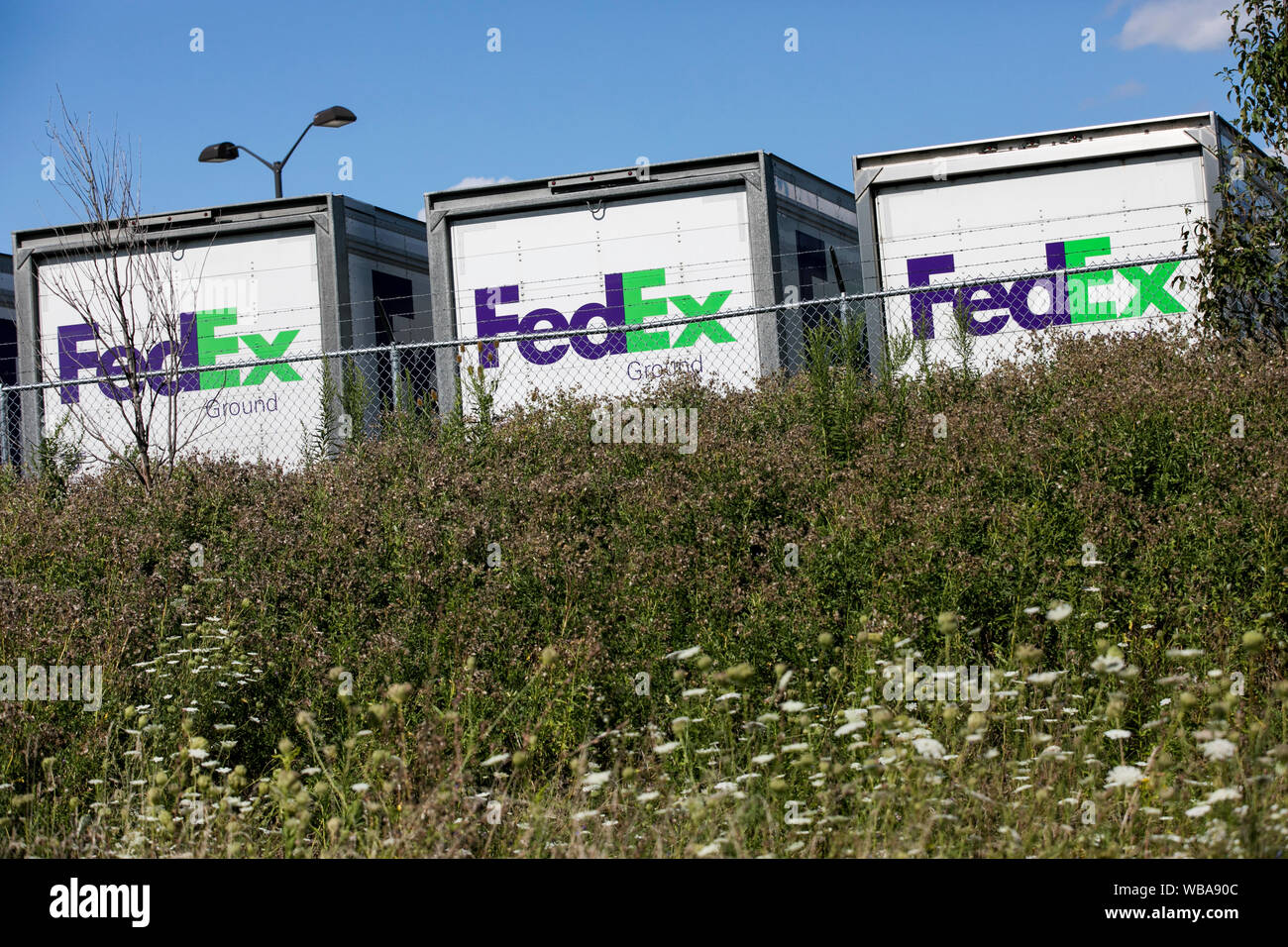 FedEx Ground logos on truck trailers at a FedEx distribution center in