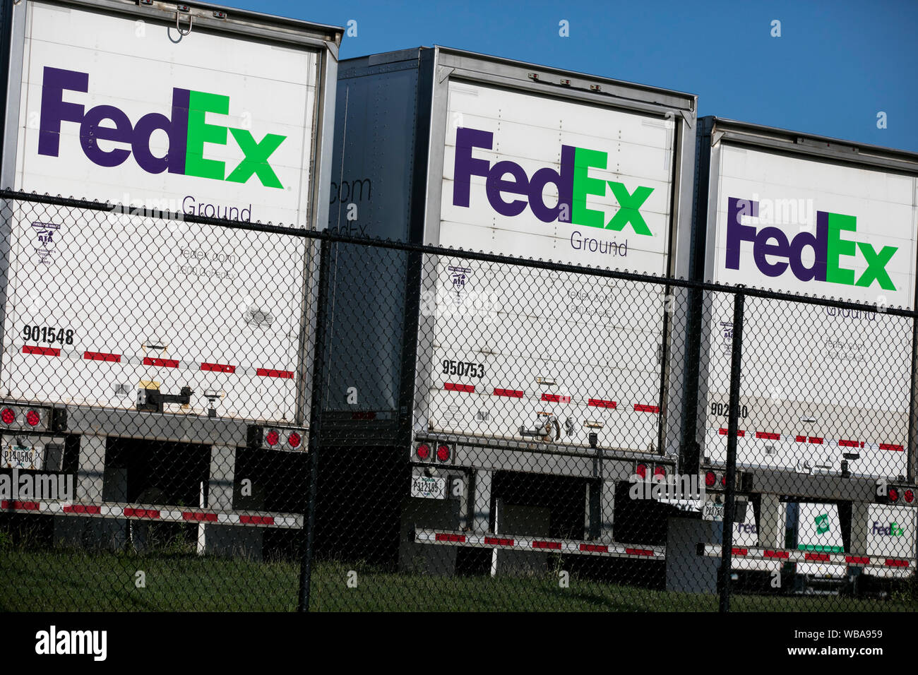 FedEx Ground logos on truck trailers at a FedEx distribution center in
