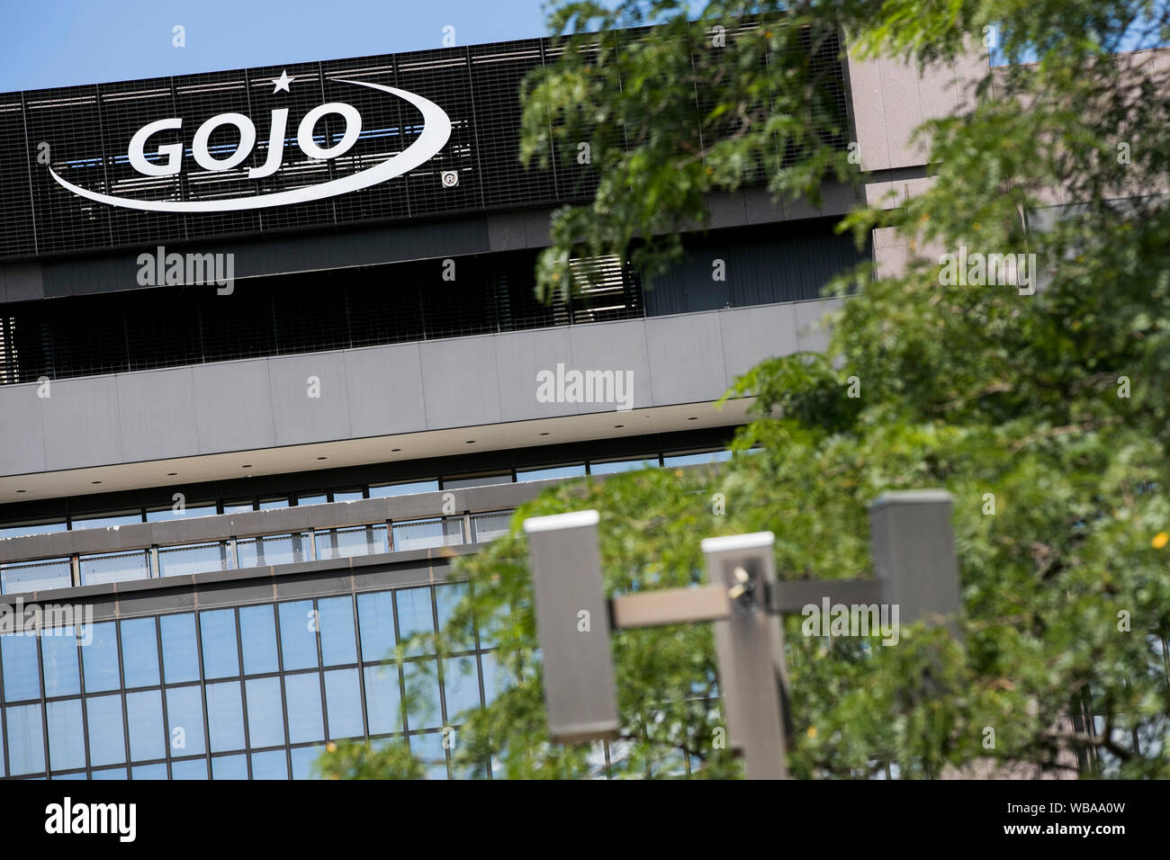 A logo sign outside of the headquarters of GOJO Industries in Akron