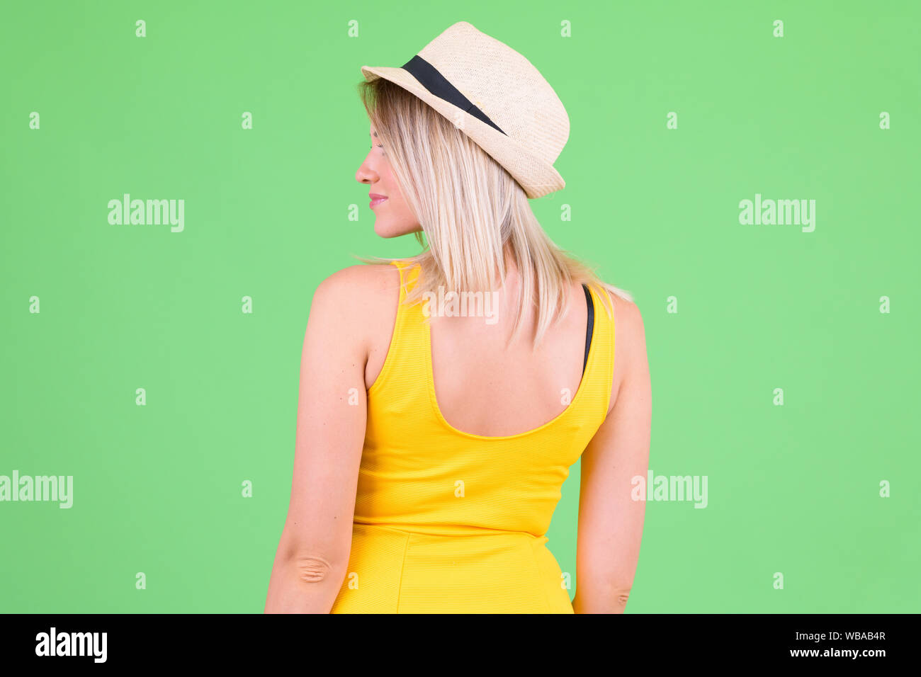 Blonde woman hat dress rear view hi-res stock photography and images ...