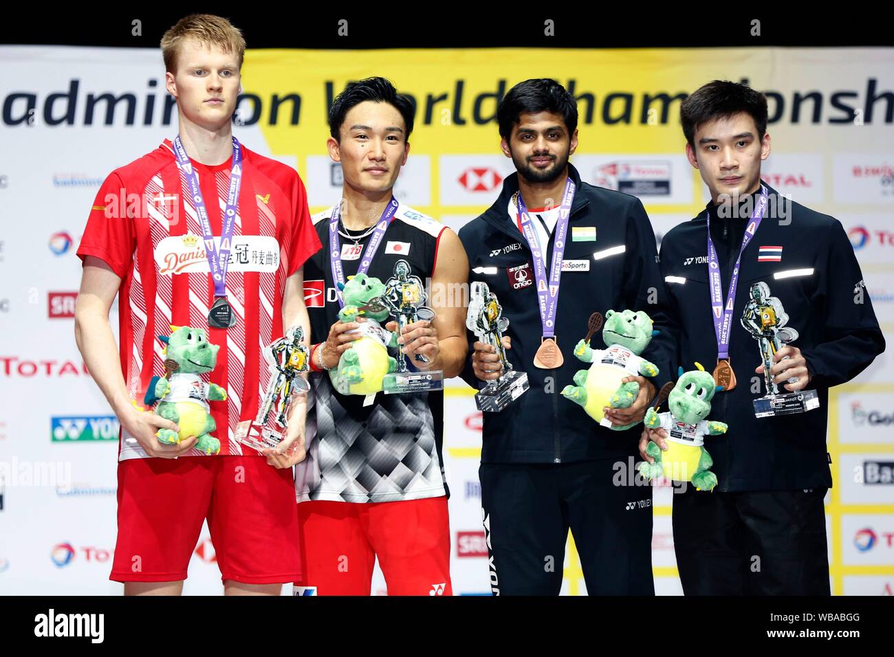 Basel Switzerland. Credit D. 25th Aug 2019. L R Anders Antonsen DEN Kento Momota JPN Sai Praneeth Bhamidipati IND Kantaphon Wangcharoen THA Badminton Winner Kento Momota of Japan poses with his medal