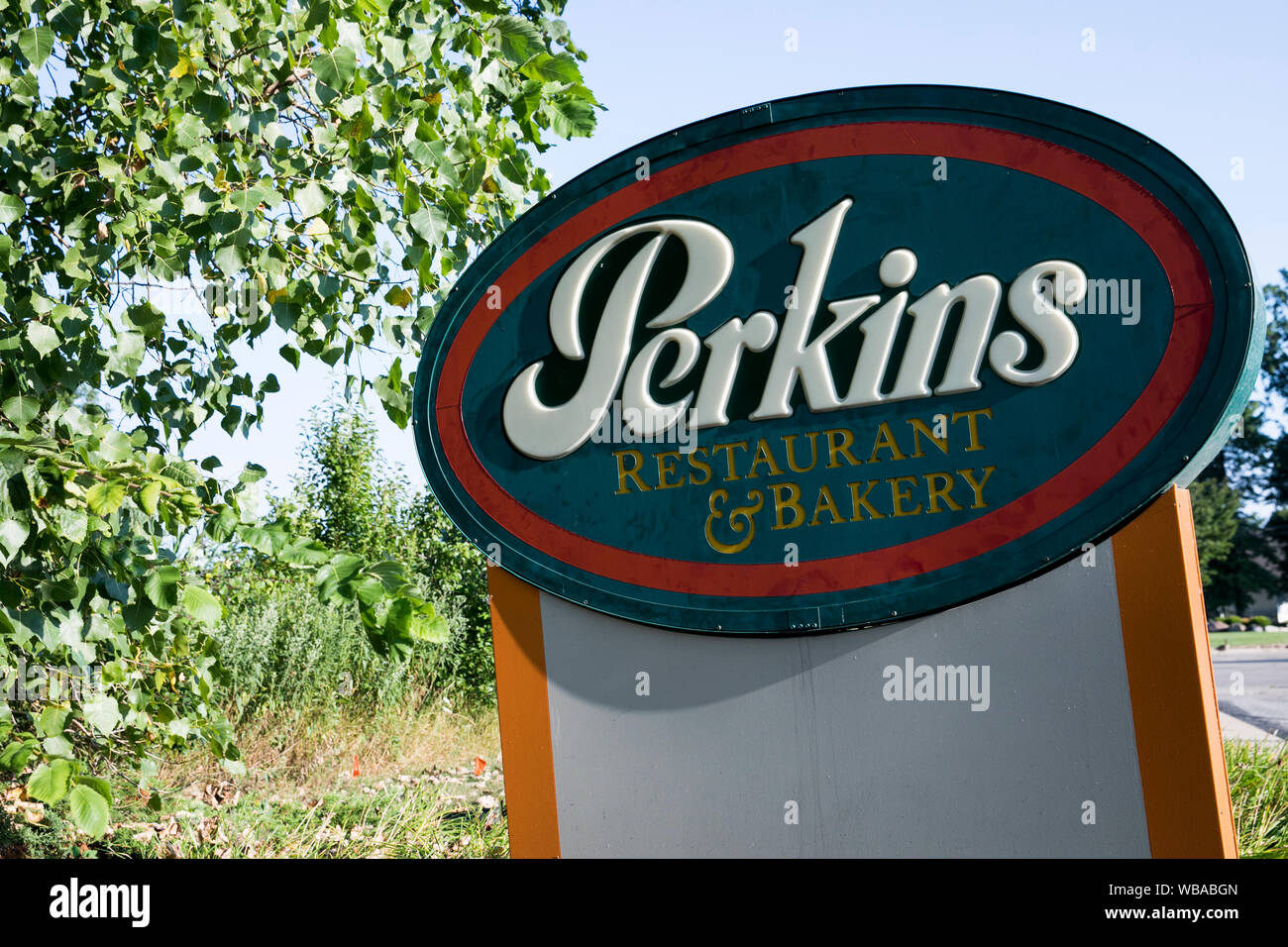 A logo sign outside of a Perkins Restaurant & Bakery location in Avon