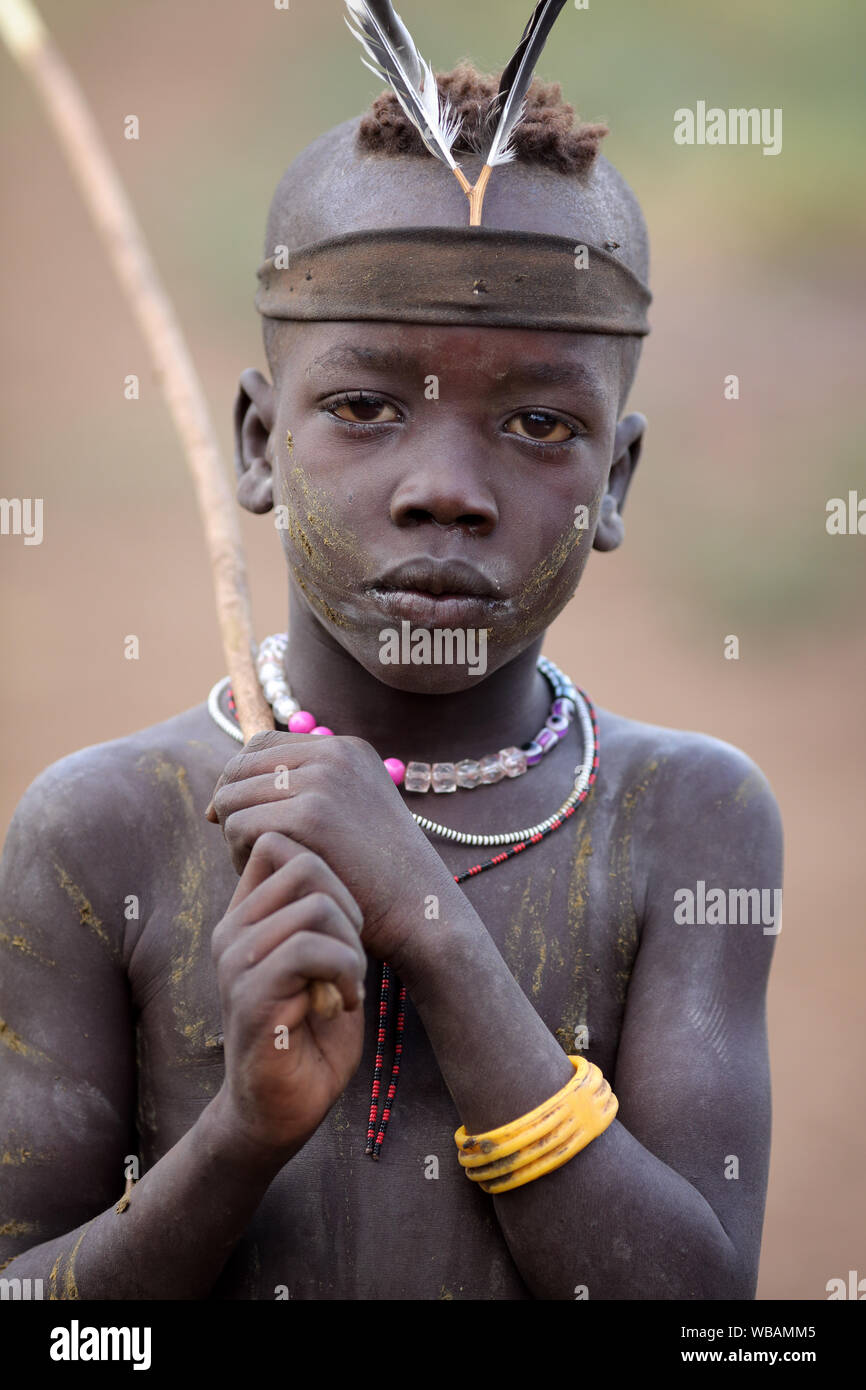 Mursi Tribal Boy In The Mago National Park Lower Omo Valley Ethiopia mursi-tribal-boy-in-the-mago-national-park-lower-omo-valley-ethiopia