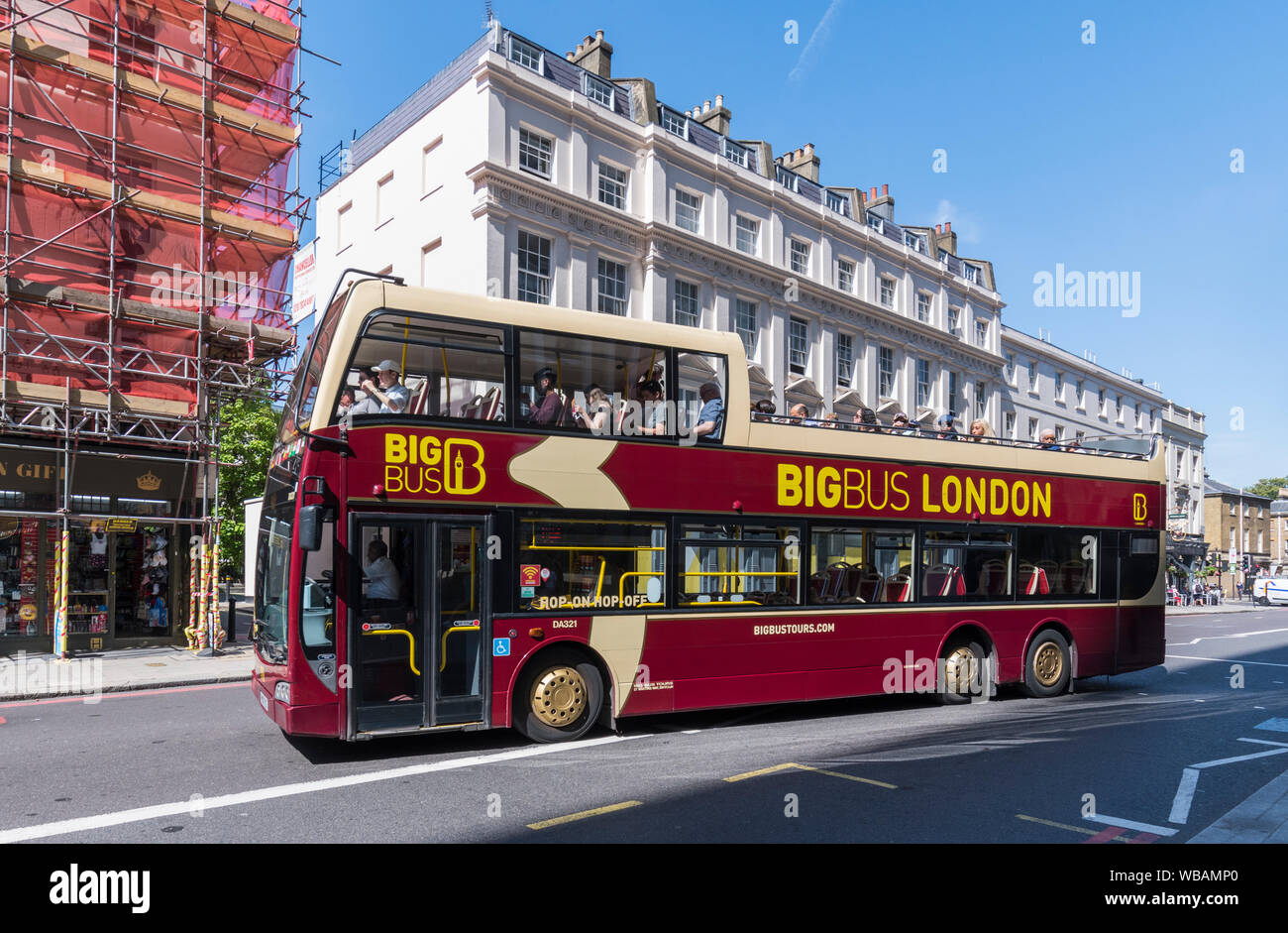 Big Bus Tours open top tour bus taking tourists around Central London  sightseeing from the bus, in the City of Westminster, London, England, UK. Stock Photo