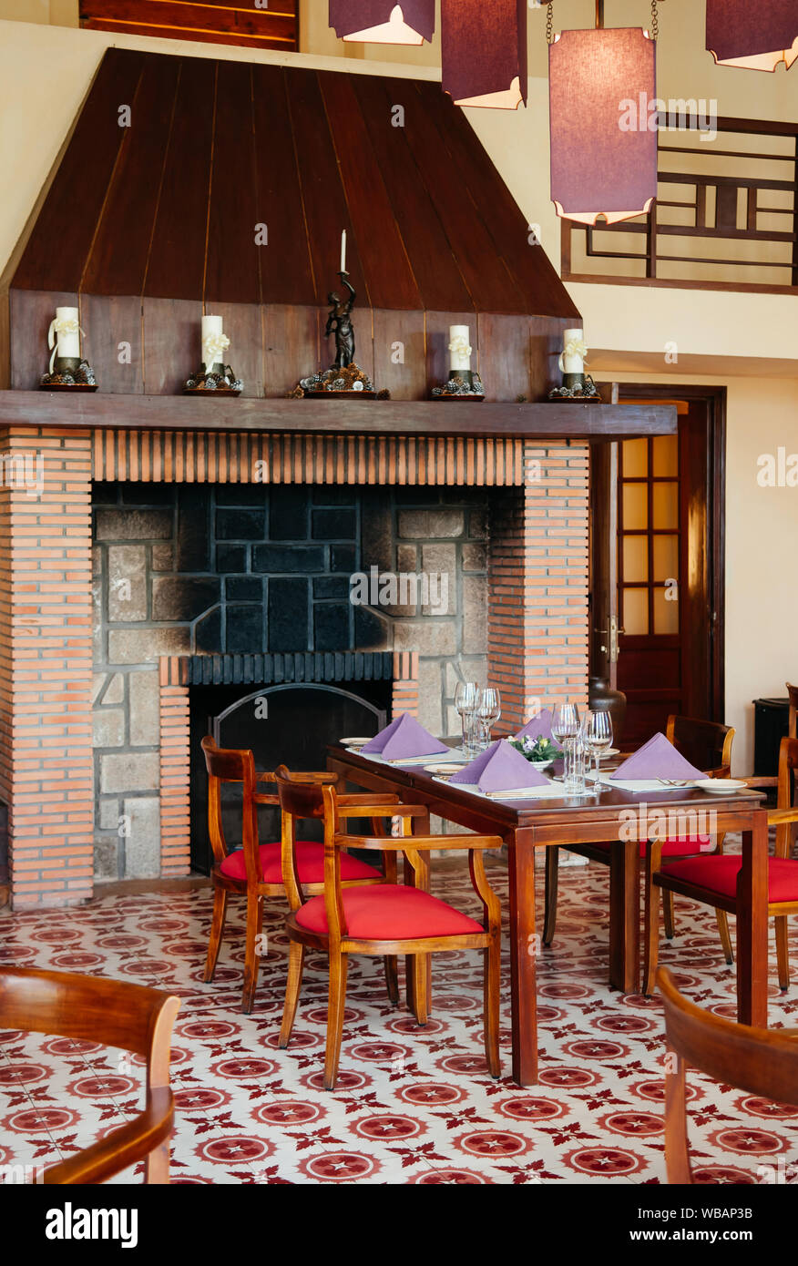 Feb 25 2014 Dalat Vietnam Dining Room With Retro Tile Floor Old Brick Fireplace Wooden Chairs Dinner Table Pedant Lamps In French Colonial House Stock Photo Alamy