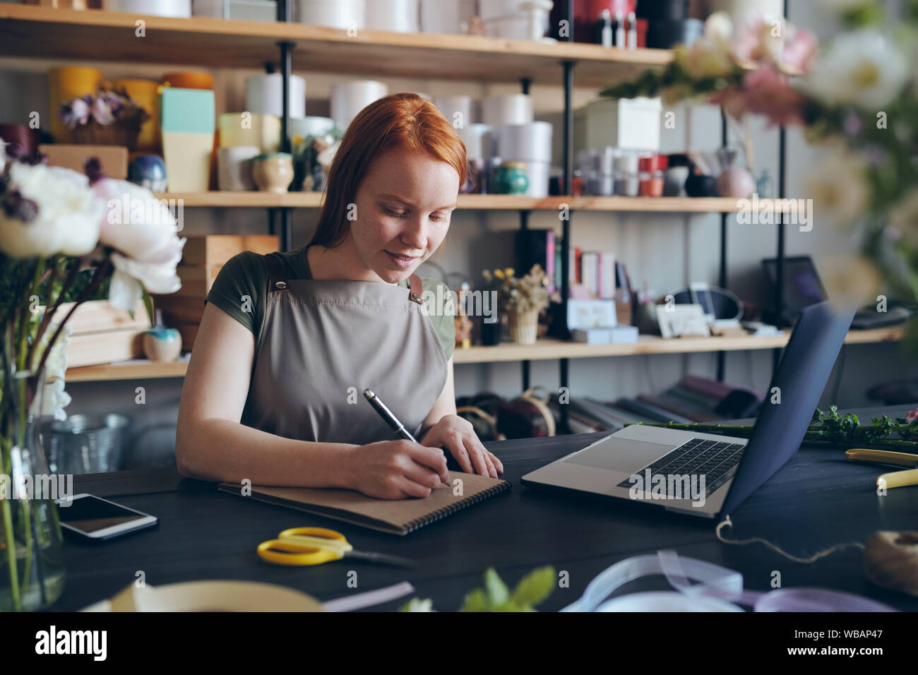 Professional businesswoman making notes using hi-res stock photography ...
