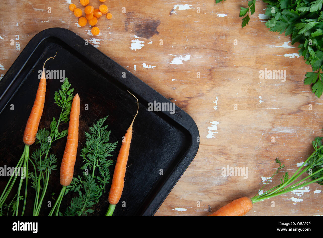 Carrots on oven tray Stock Photo Alamy