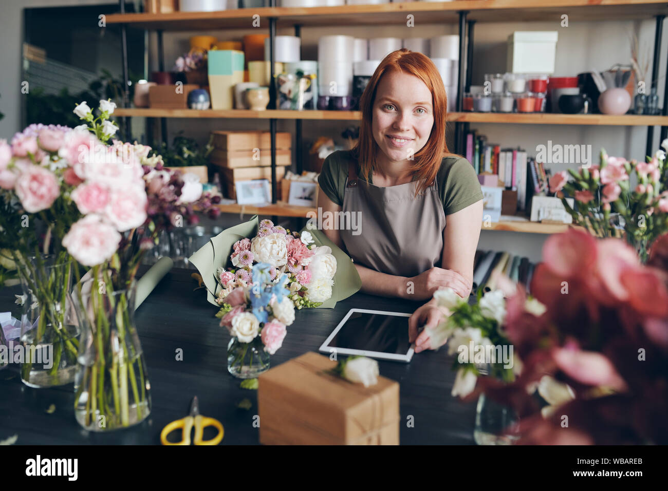 Working in cozy flower shop Stock Photo