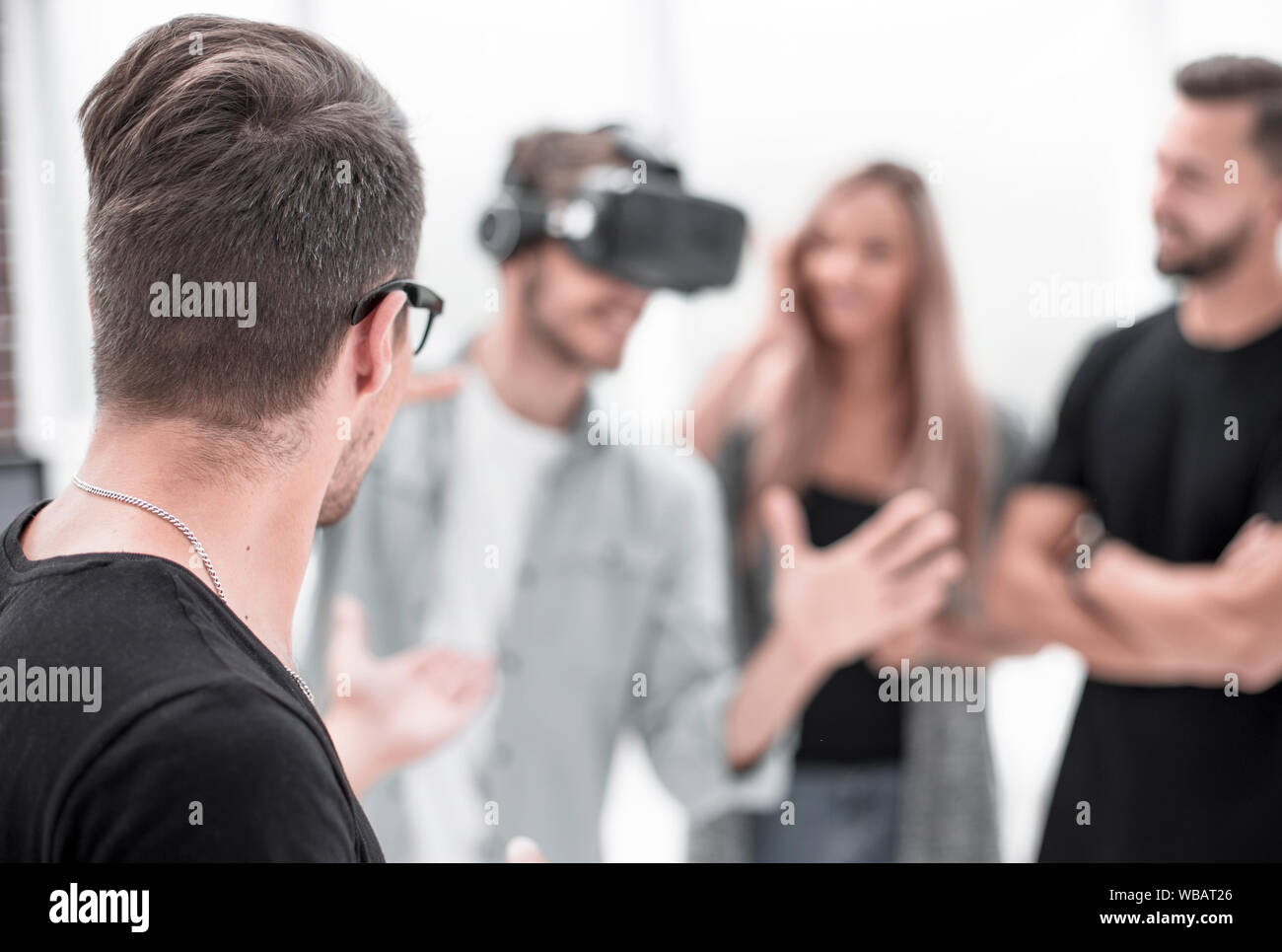Positive colleagues testing virtual reality glasses Stock Photo