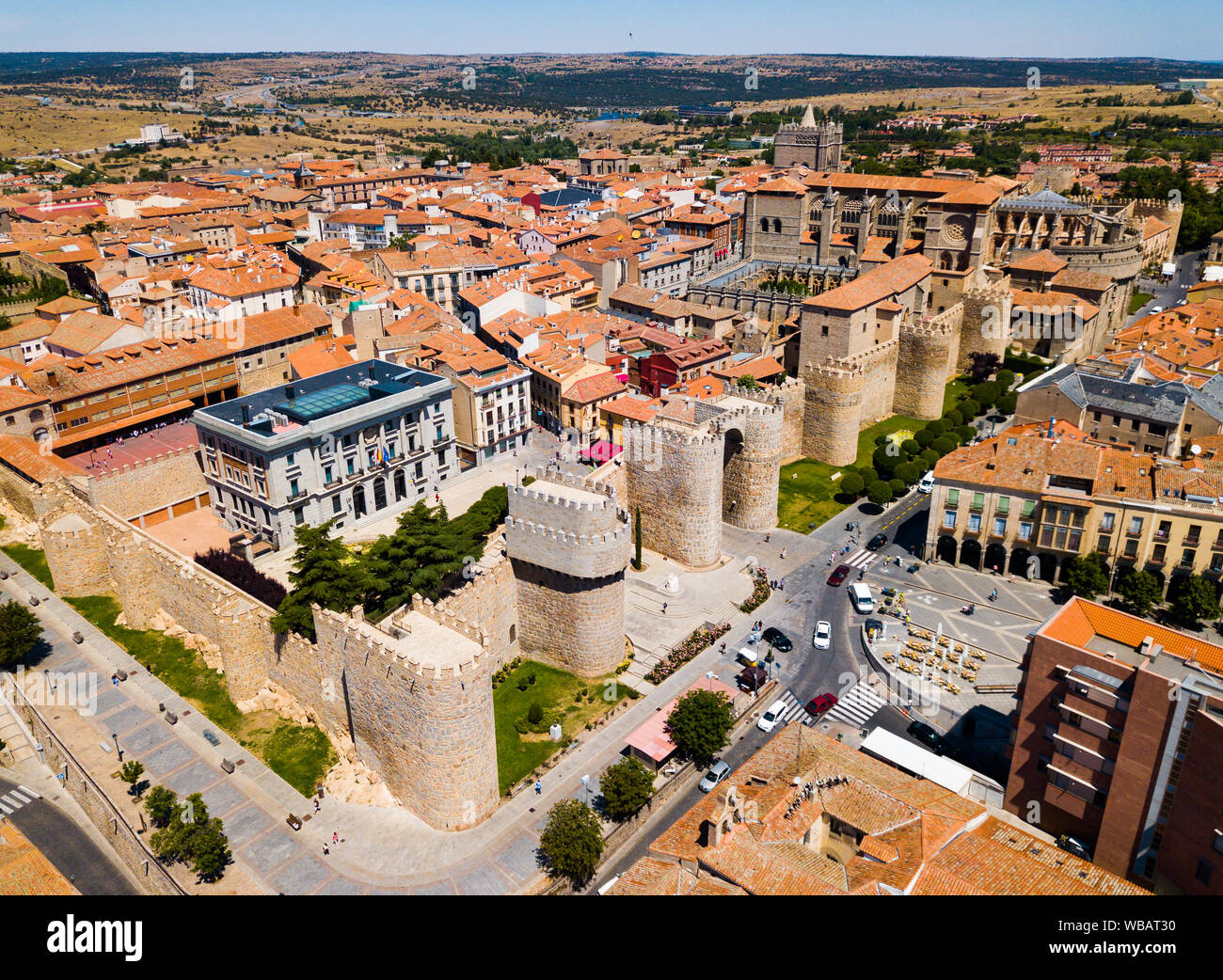 Aerial cityscape of stone defense wall and houses of ancient Avila town