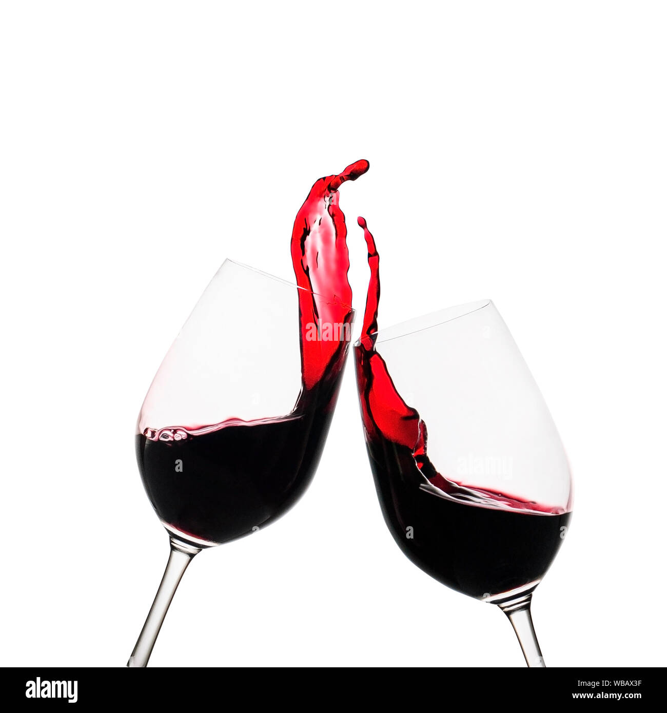 https://c8.alamy.com/comp/WBAX3F/two-clinking-glasses-of-red-wine-in-a-toast-with-freeze-motion-wine-splash-in-each-glass-as-they-tilt-towards-one-another-isolated-on-white-WBAX3F.jpg